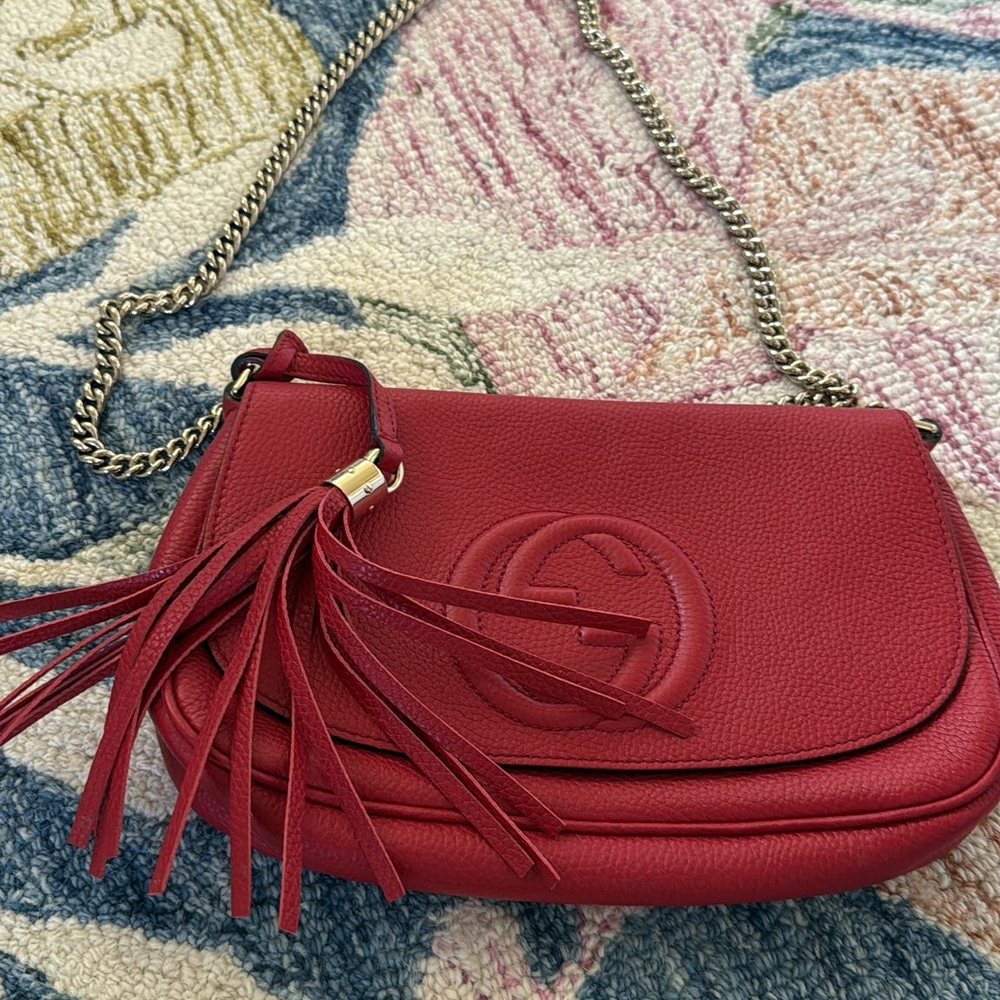 Gucci Red Crossbody Bag with Tassels and Flap Closure